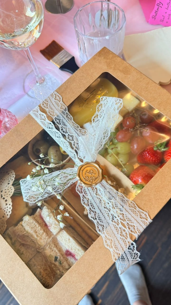 Ribboned grazing box with fruit and cheese, from a past Three Petals event